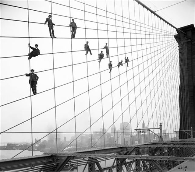 October 7th, 1914âpainters in the wires of the Brooklyn Bridge.